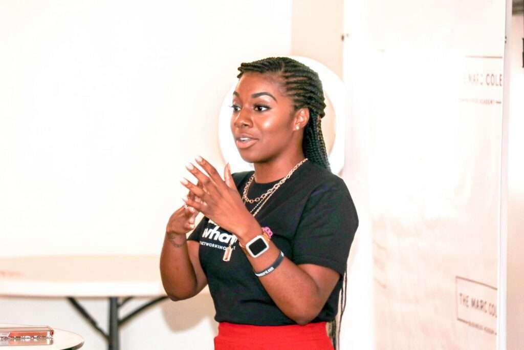 A female speaker delivering a speech.