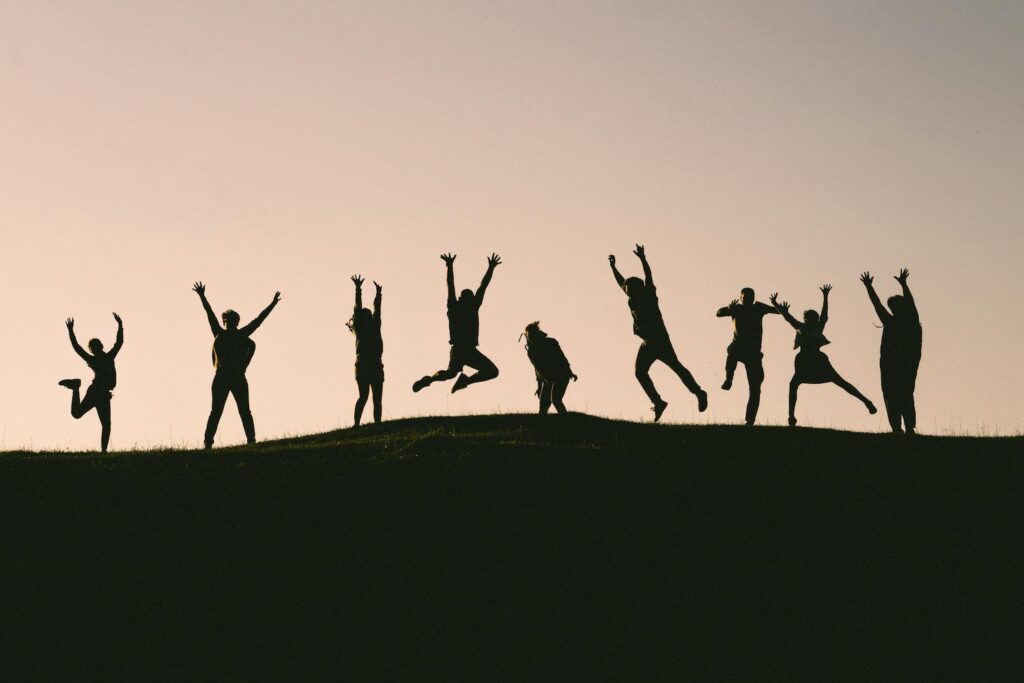 A group of people jumping in the air